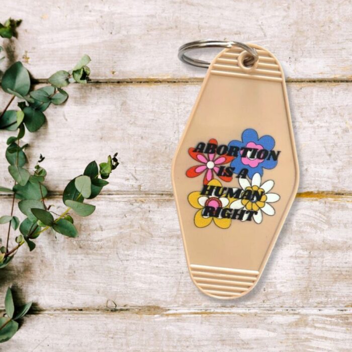 Abortion is a Human Right Keychain in Groovy 70s Flower Print 3